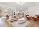 Bright living area with hardwood floors, modern lighting, and open floor plan at 106 Capanne Ct, Clayton, NC 27527
