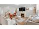 Cozy living room with modern fireplace and neutral-toned furniture at 106 Capanne Ct, Clayton, NC 27527