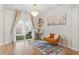 Bright living room featuring a bar area and access to an outdoor patio at 106 Capanne Ct, Clayton, NC 27527