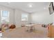 Bright playroom with carpet, natural light, and neutral decor at 106 Capanne Ct, Clayton, NC 27527