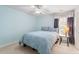 This bright bedroom features a queen bed, a side table with lamp, and soft natural light at 108 Finnway Ln, Cary, NC 27519