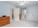 This bright, airy bedroom features light blue walls, white trim, a ceiling fan, and spacious closet at 108 Finnway Ln, Cary, NC 27519