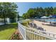 Relax poolside at the community pool with lounge chairs, umbrellas, and a nearby pond with fountain at 108 Finnway Ln, Cary, NC 27519