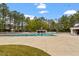 Enjoy the community pool, complete with bathhouse, and surrounded by mature trees and landscaping at 108 Finnway Ln, Cary, NC 27519