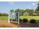 Community entrance at Preston Village with sign, green grass, and gazebo at 108 Finnway Ln, Cary, NC 27519