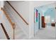 Bright stairway leading to rooms with light blue walls, carpeted stairs and stained wood banister at 108 Finnway Ln, Cary, NC 27519