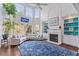 Elegant living room with fireplace, built-ins, and oversized windows at 108 Finnway Ln, Cary, NC 27519