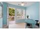 An office bathed in blue tones with an attached outdoor balcony offering stunning views at 108 Finnway Ln, Cary, NC 27519