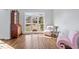 Cozy sitting room with hardwood floors, large window, comfortable seating, and stylish decor at 108 Finnway Ln, Cary, NC 27519