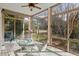 Bright sunroom surrounded by trees and nature at 108 Finnway Ln, Cary, NC 27519