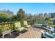 Inviting back deck featuring outdoor seating and planters at 1109 Frenchurch Way, Apex, NC 27502