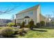 Spacious backyard with a patio, lush lawn, and mature landscaping at 1109 Frenchurch Way, Apex, NC 27502