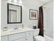 Well-maintained bathroom featuring a vanity and shower-tub combination with modern finishes at 1109 Frenchurch Way, Apex, NC 27502