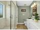 Bathroom featuring a glass enclosed shower and double sink vanity with modern fixtures at 1109 Frenchurch Way, Apex, NC 27502