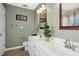 This is a view of the primary bathroom with a double sink vanity and modern fixtures at 1109 Frenchurch Way, Apex, NC 27502