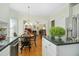 Cozy breakfast nook off kitchen with hardwood floors and view to living room with fireplace at 1109 Frenchurch Way, Apex, NC 27502
