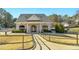 Community clubhouse with landscaped walkway, stone accents, and convenient parking at 1109 Frenchurch Way, Apex, NC 27502