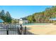 Community pool area featuring a large swimming pool, sun deck, and shaded seating at 1109 Frenchurch Way, Apex, NC 27502
