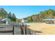 Community pool area featuring a large swimming pool, sun deck, and shaded seating at 1109 Frenchurch Way, Apex, NC 27502