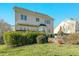 Rear exterior of the home featuring a large backyard, deck, and mature landscaping at 1109 Frenchurch Way, Apex, NC 27502