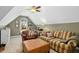 Attic living room with vaulted ceilings, comfortable furniture, and lots of natural light at 1109 Frenchurch Way, Apex, NC 27502
