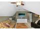 Attic living room with vaulted ceilings and neutral walls at 1109 Frenchurch Way, Apex, NC 27502