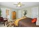 Comfortable main bedroom featuring a ceiling fan, neutral walls, and a full ensuite bathroom at 1109 Frenchurch Way, Apex, NC 27502