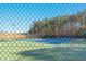 Community tennis courts with green and blue playing surfaces, secured by chain-link fencing at 1109 Frenchurch Way, Apex, NC 27502