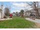 Expansive backyard featuring a patio, fire pit, playground, and ample green space for outdoor activities at 11228 N Radner Way, Raleigh, NC 27613