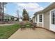 Outdoor patio features seating with views of the backyard and the surrounding neighborhood at 11228 N Radner Way, Raleigh, NC 27613