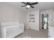 Cozy Bedroom showcases a crib, soft carpet, and a small bookshelf at 11228 N Radner Way, Raleigh, NC 27613