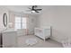 Comfortable Bedroom showcases a crib, dresser, and natural light from the window at 11228 N Radner Way, Raleigh, NC 27613