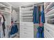 Organized walk-in closet with built-in shelves, drawers, and clothing racks for ample storage at 11228 N Radner Way, Raleigh, NC 27613