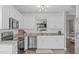 Bright kitchen featuring white cabinets, granite countertops, and stainless steel appliances at 11228 N Radner Way, Raleigh, NC 27613