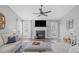 Cozy living room featuring a fireplace and ceiling fan at 11228 N Radner Way, Raleigh, NC 27613