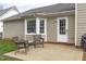 Back patio featuring outdoor seating, overlooking a private backyard at 11228 N Radner Way, Raleigh, NC 27613