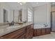 Bathroom with double sinks, dark wood cabinets, separate shower and soaking tub at 121 Starlight Dr, Lillington, NC 27546