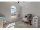 Neutral-toned bedroom with unique arched window and work space at 121 Starlight Dr, Lillington, NC 27546