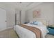 Bright bedroom featuring a comfortable king bed, soft carpet, and stylish blue accents at 121 Starlight Dr, Lillington, NC 27546