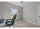 Bedroom with neutral carpet and paint; window provides ample natural light at 121 Starlight Dr, Lillington, NC 27546