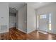 Inviting foyer with hardwood floors and white front door and trim at 121 Starlight Dr, Lillington, NC 27546