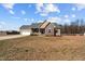 Charming single-Gathering home featuring a two-car garage, dormer windows, and a cozy front porch at 121 Starlight Dr, Lillington, NC 27546