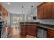 Kitchen features granite countertops, stainless appliances and opens into a dining area with great view at 121 Starlight Dr, Lillington, NC 27546
