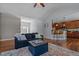 Inviting living room featuring hardwood floors, open layout, and seamless flow to the kitchen at 121 Starlight Dr, Lillington, NC 27546