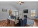 Inviting living room with vaulted ceiling, fireplace, and seamless flow to the kitchen at 121 Starlight Dr, Lillington, NC 27546