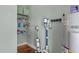 A utility and storage area with shelving, modern vacuums and equipment, and water heater at 121 Starlight Dr, Lillington, NC 27546