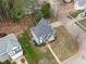 Aerial view of property featuring manicured lawn and mature trees at 1233 Dunn Creek Xing, Wake Forest, NC 27587