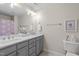 Bathroom showcasing double vanity with modern fixtures, and neutral tones at 1233 Dunn Creek Xing, Wake Forest, NC 27587