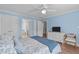Inviting bedroom with a ceiling fan, comfortable bed, and easy access to the bathroom at 1233 Dunn Creek Xing, Wake Forest, NC 27587