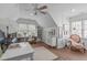 Bonus room with natural light, sloped ceiling, and built in shelving at 1233 Dunn Creek Xing, Wake Forest, NC 27587